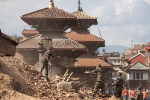Soldiers searching earthquake rubble