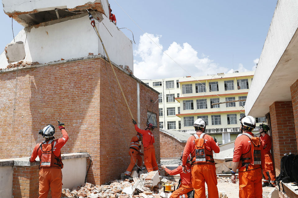 Firefighters at work in earthquake damaged hospital in Nepal