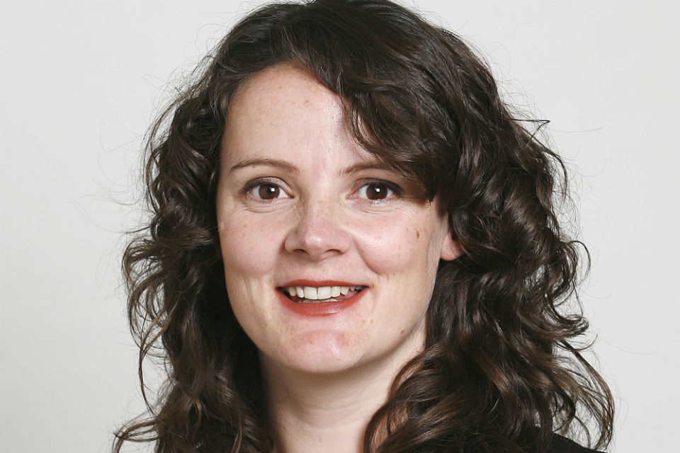 Head shot of woman with long dark hair