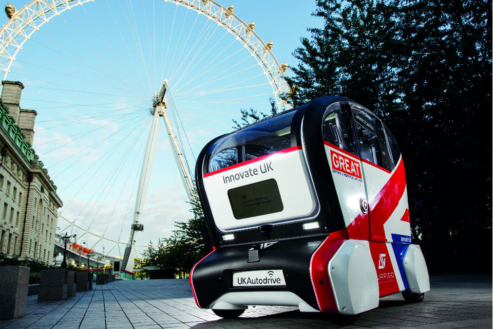 Image of prototype driverless vehicle in 'GREAT' campaign livery, with the London Eye in the background