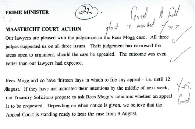 Part of a typed message to Prime Minister John Major on the judgment in the court action on the Maastricht Treaty, with the PM's handwritten note