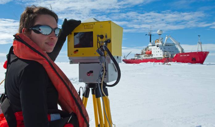 A scientist from the British Antarctic Survey taking readings using LiDAR (Light Detection and Ranging) technology